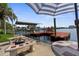 Private dock with seating, boat lift, and patio furniture; perfect for enjoying waterfront living at 4523 Gulfstream Dr, Hernando Beach, FL 34607