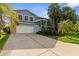 A well-maintained home featuring a two-car garage, stylish siding, and professional landscaping in a Gathering-friendly neighborhood at 4523 Gulfstream Dr, Hernando Beach, FL 34607