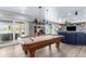 Game room features a pool table, ceiling fan, and slider doors to the outdoor patio at 4523 Gulfstream Dr, Hernando Beach, FL 34607