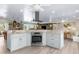 Gourmet kitchen with stainless steel oven, granite counters, and ample cabinet space open to living area at 4523 Gulfstream Dr, Hernando Beach, FL 34607