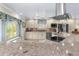 Bright and modern kitchen featuring granite countertops, stainless steel appliances, and custom cabinetry at 4523 Gulfstream Dr, Hernando Beach, FL 34607