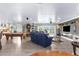 Spacious living area with pool table, fireplace, and large windows offering scenic views at 4523 Gulfstream Dr, Hernando Beach, FL 34607