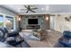 A comfortable living room features a sleek fireplace, TV, modern decor, and stylish furnishings for relaxation at 4523 Gulfstream Dr, Hernando Beach, FL 34607