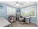 Bright home office with built-in desks, plenty of natural light, and neutral decor at 4523 Gulfstream Dr, Hernando Beach, FL 34607