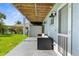 Outdoor patio has comfortable seating and a view of the yard at 4523 Gulfstream Dr, Hernando Beach, FL 34607