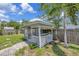 A charming gazebo featuring a hammock, a decorative lattice and situated in a verdant back yard at 4619 W Bay Villa Ave, Tampa, FL 33611