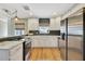 Updated kitchen featuring stainless steel appliances, sleek countertops, and stylish subway tile backsplash at 4619 W Bay Villa Ave, Tampa, FL 33611