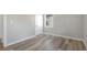 This bedroom features modern light-colored walls and beautiful wood-look floors at 5048 5Th S Ave, St Petersburg, FL 33707
