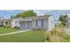 Charming single-story home boasts a well-manicured lawn and lovely curb appeal at 5048 5Th S Ave, St Petersburg, FL 33707