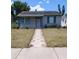 Inviting single-story home with a patterned walkway leading to the front door, and tidy lawn at 5048 5Th S Ave, St Petersburg, FL 33707