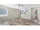Bright living room featuring modern wood floors, ample natural light, and neutral decor at 5048 5Th S Ave, St Petersburg, FL 33707