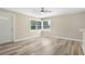 Cozy living space featuring modern wood flooring and an inviting atmosphere at 5048 5Th S Ave, St Petersburg, FL 33707