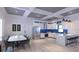 Modern kitchen and dining area featuring white cabinetry, stainless steel appliances, and marble counters at 5200 7Th N Ave, St Petersburg, FL 33710
