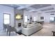 Open living area with stone fireplace, coffered ceilings, and adjacent dining space at 5200 7Th N Ave, St Petersburg, FL 33710