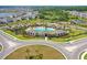 Aerial view of the community pool, clubhouse, playground, and lush landscaping at 5214 Granite Dust Pl, Palmetto, FL 34221