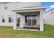 Covered back porch with comfortable seating, rug, and a view of the backyard at 5214 Granite Dust Pl, Palmetto, FL 34221