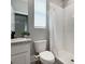 Small bathroom featuring a vanity, toilet, and a shower with white tiling at 5214 Granite Dust Pl, Palmetto, FL 34221