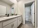Bathroom featuring a double sink vanity, large mirror, and shower-tub combo at 5214 Granite Dust Pl, Palmetto, FL 34221