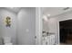 Half bathroom featuring a decorative wall-mounted gecko and bright neutral tones at 5214 Granite Dust Pl, Palmetto, FL 34221