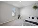Neutral bedroom with a window providing natural light and carpet flooring at 5214 Granite Dust Pl, Palmetto, FL 34221