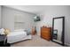 Neutral bedroom featuring carpet flooring and a TV mounted on the wall at 5214 Granite Dust Pl, Palmetto, FL 34221