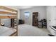 Neutral bedroom featuring carpet flooring, a bunk bed, and a window at 5214 Granite Dust Pl, Palmetto, FL 34221
