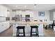 Modern kitchen with granite countertops, stainless steel appliances and large island with seating at 5214 Granite Dust Pl, Palmetto, FL 34221
