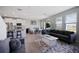 Open concept living area features kitchen island seating, dining area and living room with lots of light at 5214 Granite Dust Pl, Palmetto, FL 34221