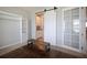 Home office featuring a sliding barn door, large desk space, and natural light, perfect for remote work at 5214 Granite Dust Pl, Palmetto, FL 34221