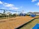 Community playground featuring swings, slides, and a climbing structure for hours of fun and activity at 5214 Granite Dust Pl, Palmetto, FL 34221