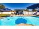 Refreshing pool with brick trim and an outdoor dining area at 5509 Bluejay Ln, Tampa, FL 33625