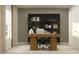 Inviting home office with modern desk, comfortable chair, and natural light at 5739 Yellow Hornbill Ave, Wimauma, FL 33598