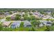 An aerial photograph of a residential neighborhood with lush greenery and well-maintained homes at 5809 Silas Creek Ln, Wesley Chapel, FL 33545