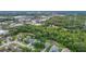 An aerial shot showing neighborhood proximity to commercial areas and conservation land at 5809 Silas Creek Ln, Wesley Chapel, FL 33545