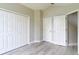 Spacious bedroom featuring double door closets and a bright, open layout at 5809 Silas Creek Ln, Wesley Chapel, FL 33545