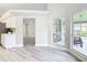 Open kitchen eating area with modern appliances, bright light, and view of patio for relaxing and entertaining at 5809 Silas Creek Ln, Wesley Chapel, FL 33545