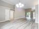 This spacious open living space with modern floors is ready for any design at 5809 Silas Creek Ln, Wesley Chapel, FL 33545