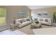 Stylishly decorated living room with coastal-inspired decor and artwork, complemented by comfortable white sofas at 5809 Silas Creek Ln, Wesley Chapel, FL 33545