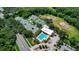 Aerial view showcasing multiple tennis courts alongside a community pool at 6011 Pratt St, Tampa, FL 33647