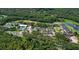 Aerial view of property amenities featuring a community pool, parking, and clubhouse at 6011 Pratt St, Tampa, FL 33647