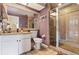 Clean bathroom features tile flooring, granite countertop, and a glass enclosed shower at 6011 Pratt St, Tampa, FL 33647