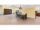 Open concept dining area with plenty of room for entertaining and a table setting at 6011 Pratt St, Tampa, FL 33647