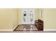Charming entryway with decorative tile flooring, bench seating, and a double door entry at 6011 Pratt St, Tampa, FL 33647