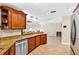 Spacious kitchen with granite countertops, stainless steel appliances, and tile floors at 6011 Pratt St, Tampa, FL 33647