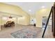 Bright and airy living room featuring tile floors, high ceilings, and ample space at 6011 Pratt St, Tampa, FL 33647