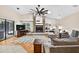 Spacious living room with fireplace, hardwood floors, and sliding glass doors leading to the outdoor area at 6011 Pratt St, Tampa, FL 33647