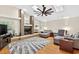 Inviting living room with a fireplace, ceiling fan, and a cozy seating area at 6011 Pratt St, Tampa, FL 33647