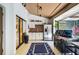 Outdoor kitchen with stainless steel appliances, granite countertop, cabinets and grill at 6011 Pratt St, Tampa, FL 33647