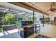 The screened-in patio has an outdoor kitchen area perfect for entertaining at 6011 Pratt St, Tampa, FL 33647