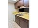 Kitchen with stainless steel sink, tile floor and white dishwasher at 6324 Newtown Cir # 24B2, Tampa, FL 33615